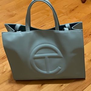 Gently used Telfar medium pool blue shopping bag